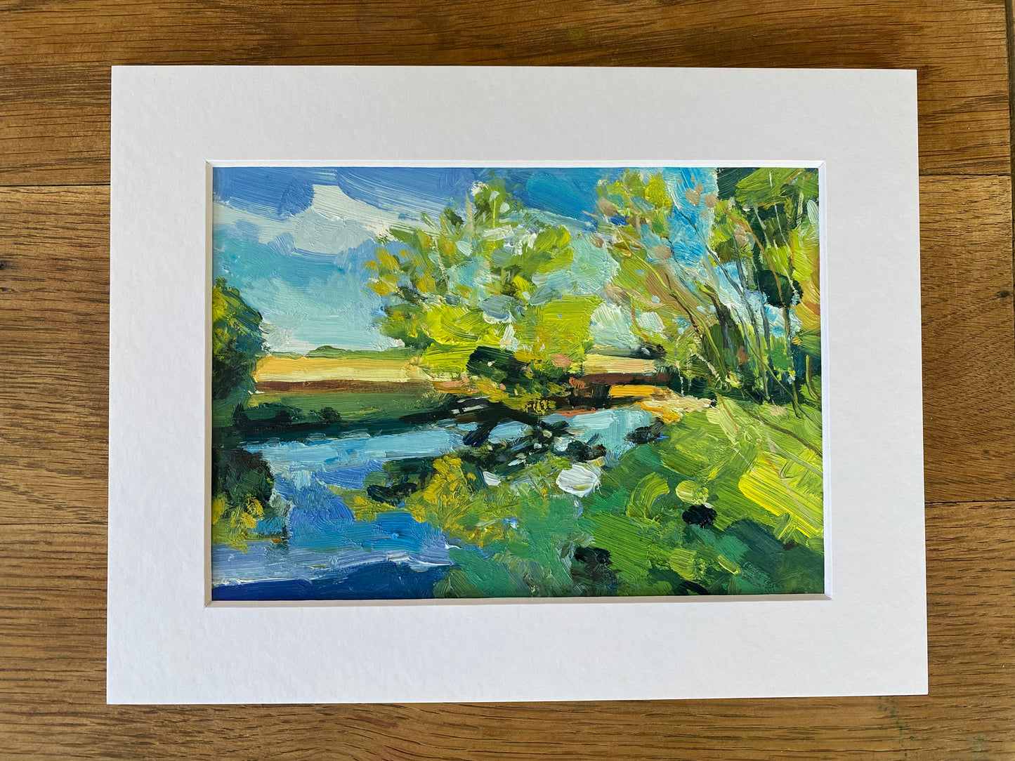 Blue Skies and Ochre Fields Along The River